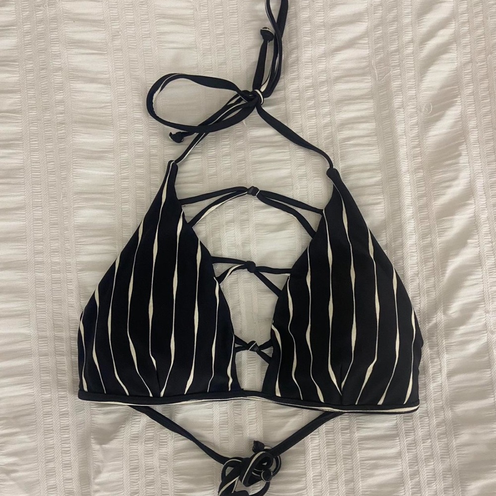 BILLABONG Black and white striped bikini top with adjustable straps.